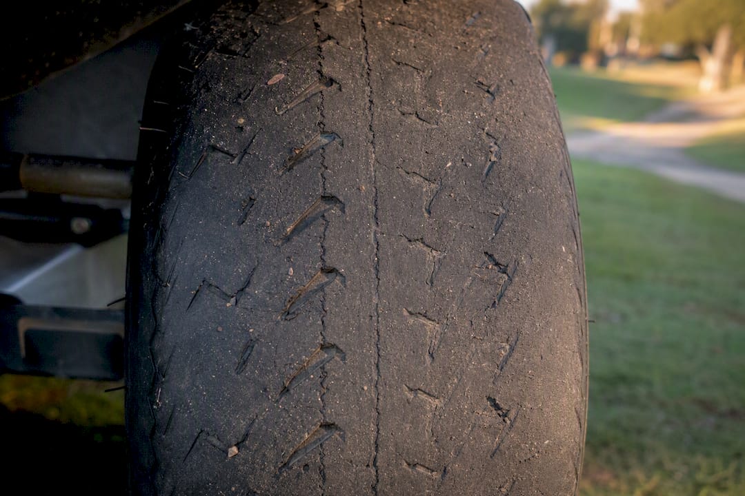 Close-up of worn golf cart tire tread