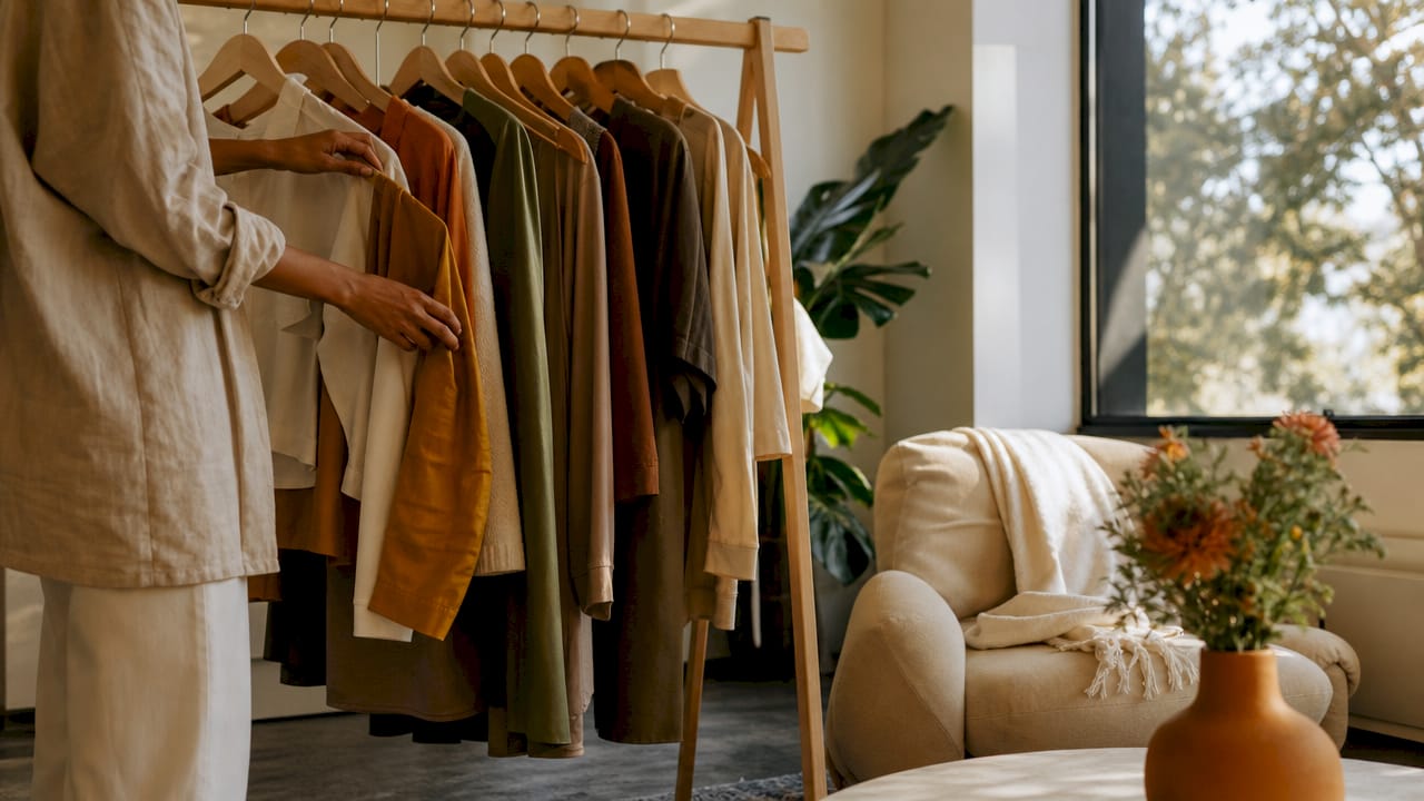 Hands selecting clothes for personal style