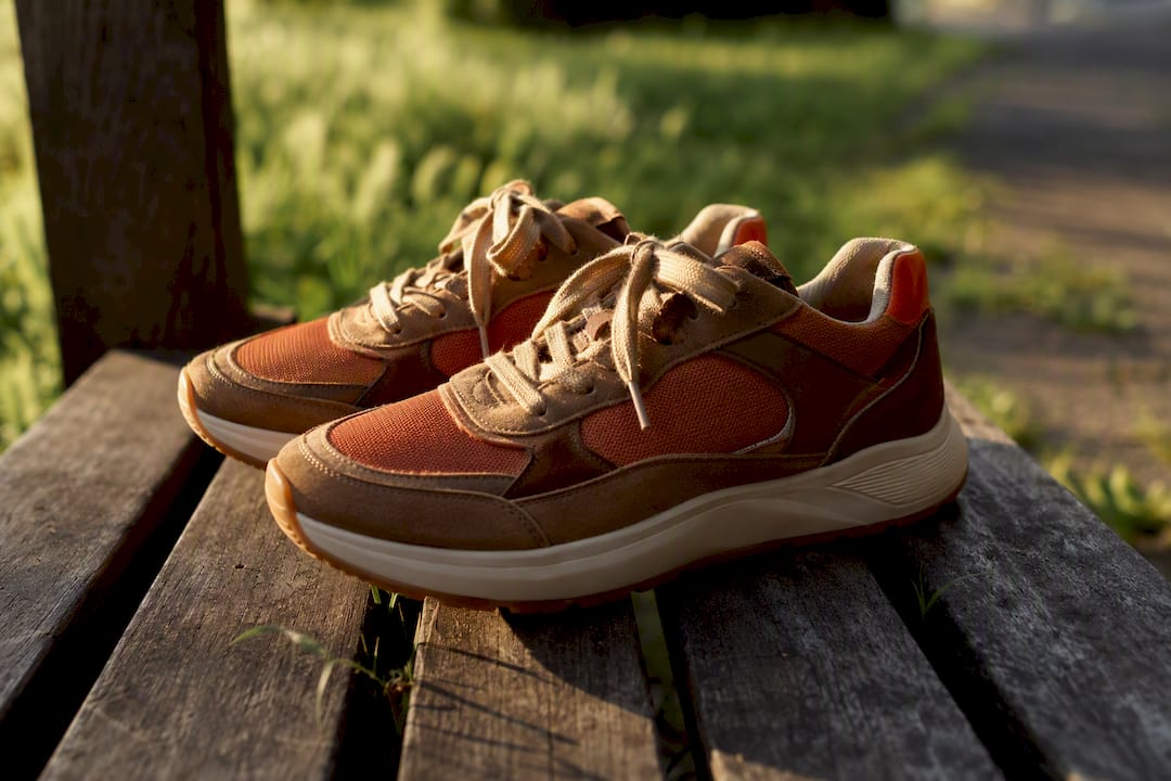 Comfort sport sneakers close-up on stone surface