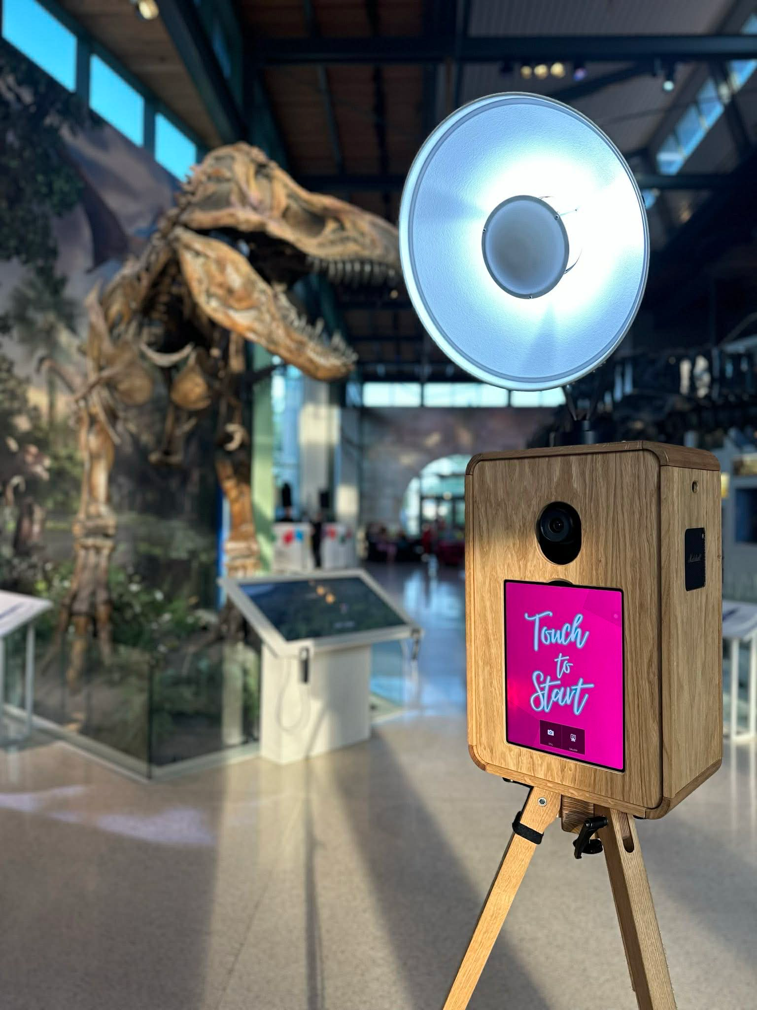 Wedding guests using open-air photo booth
