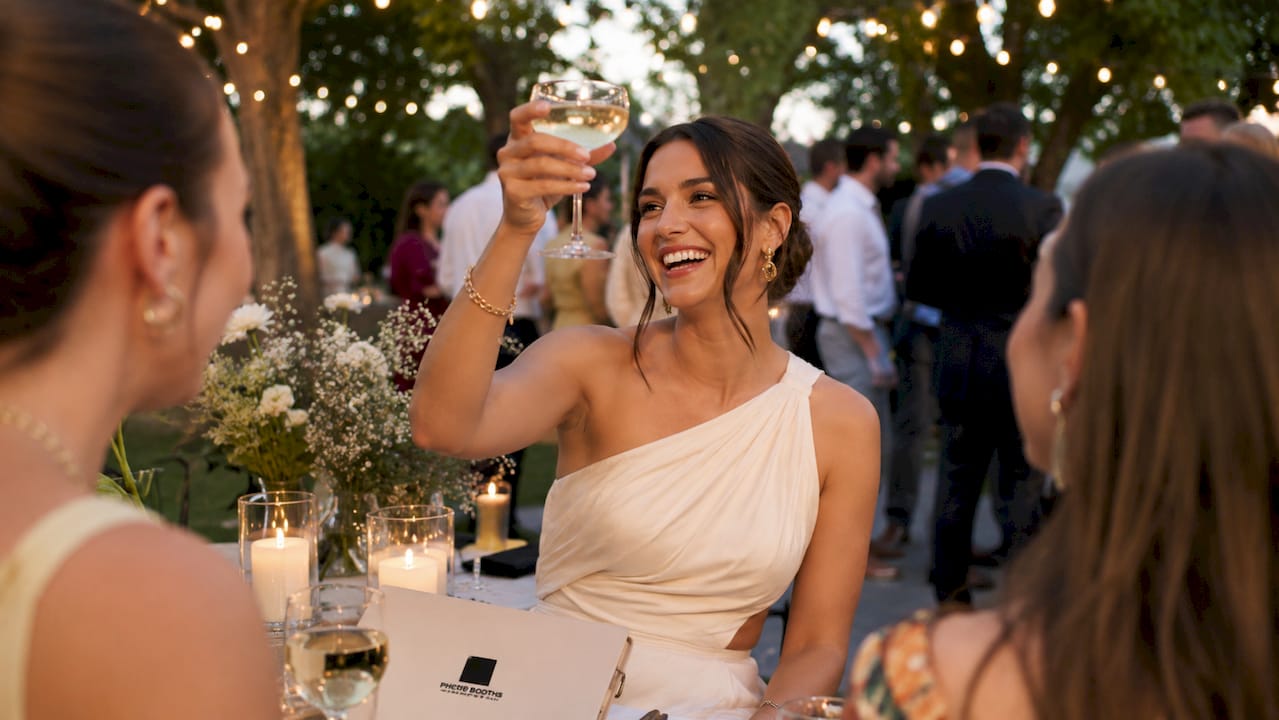 Guest holding cocktail glass at wedding party