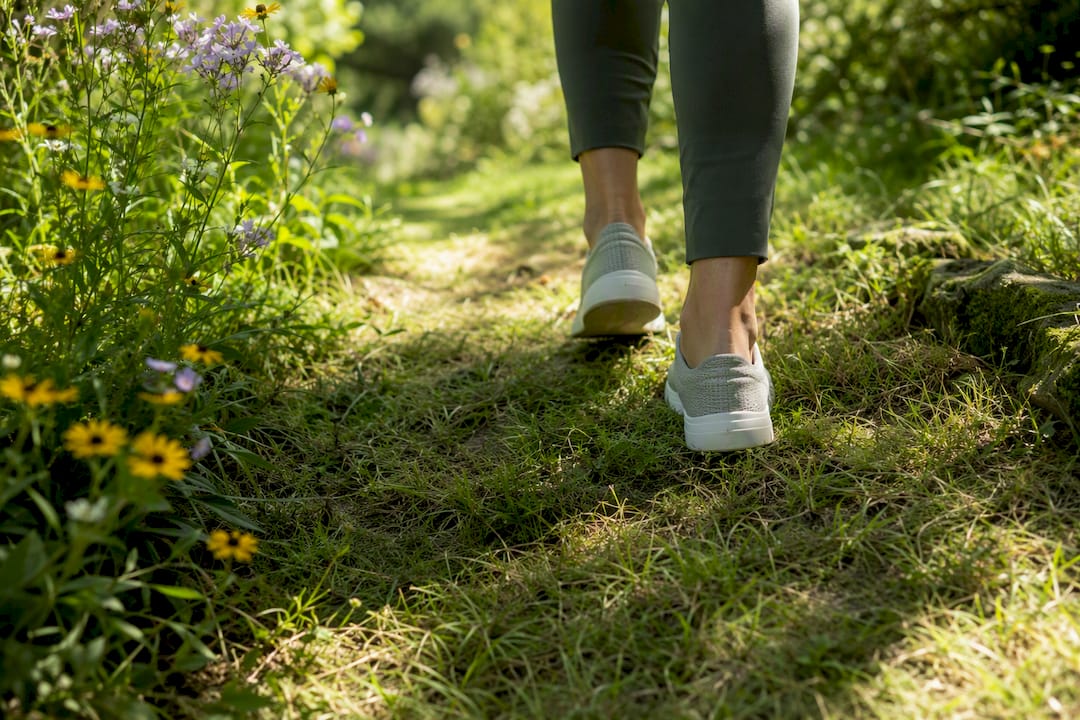 Feet walking slowly on natural trail