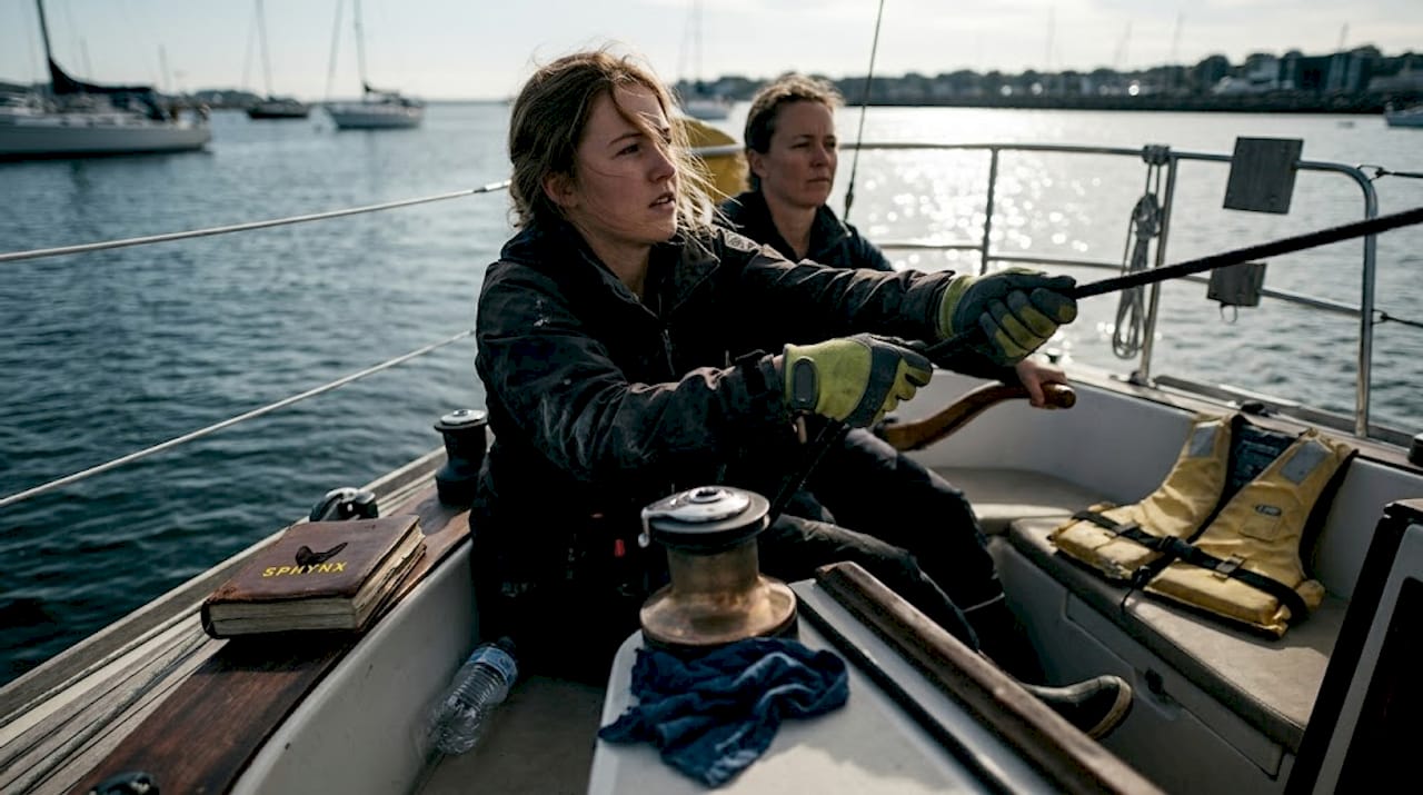 Sailing crew tacking maneuver in cockpit