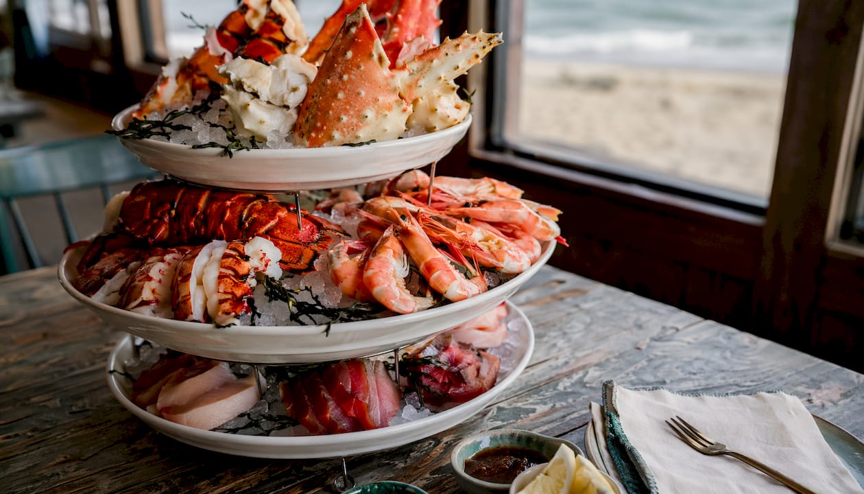 Tiered seafood tower on marble island indoors