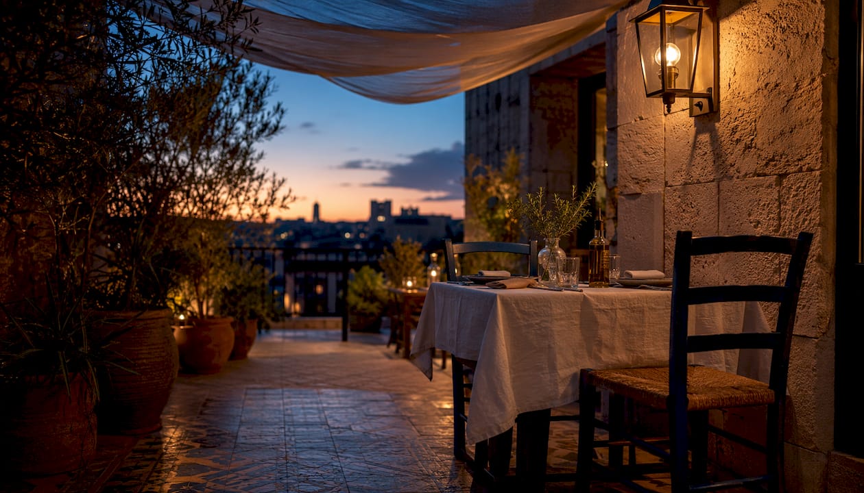 Empty restaurant terrace with warm evening light in Barcelona