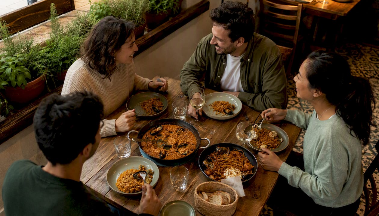 Guests enjoying Mediterranean rice dishes at Elspescadors terrace