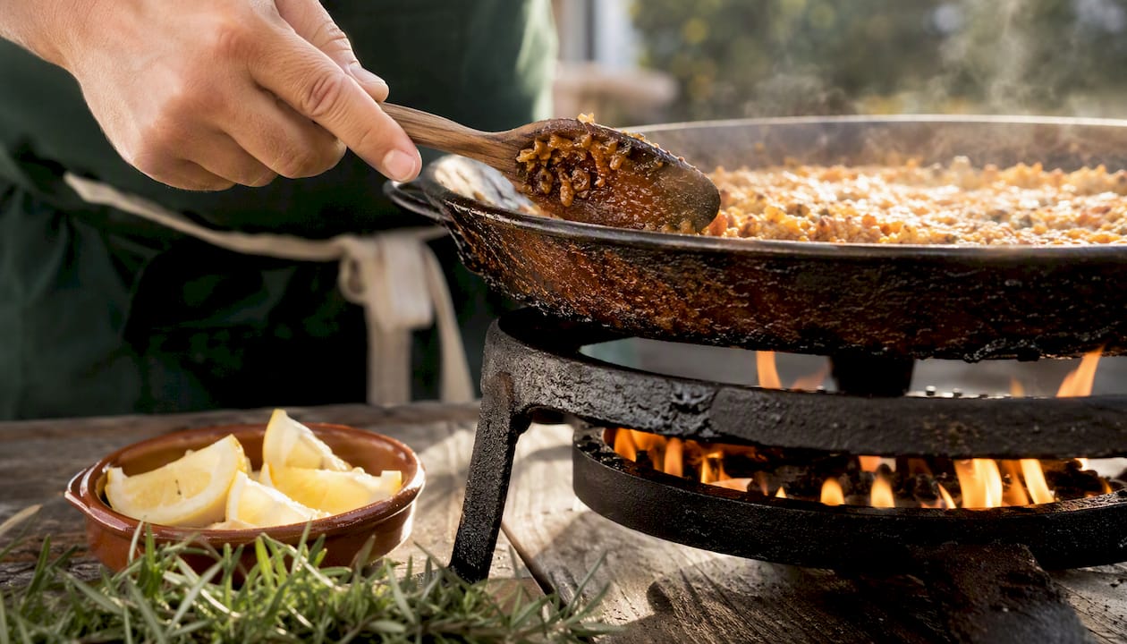 Caramelized crispy socarrat rice layer in pan