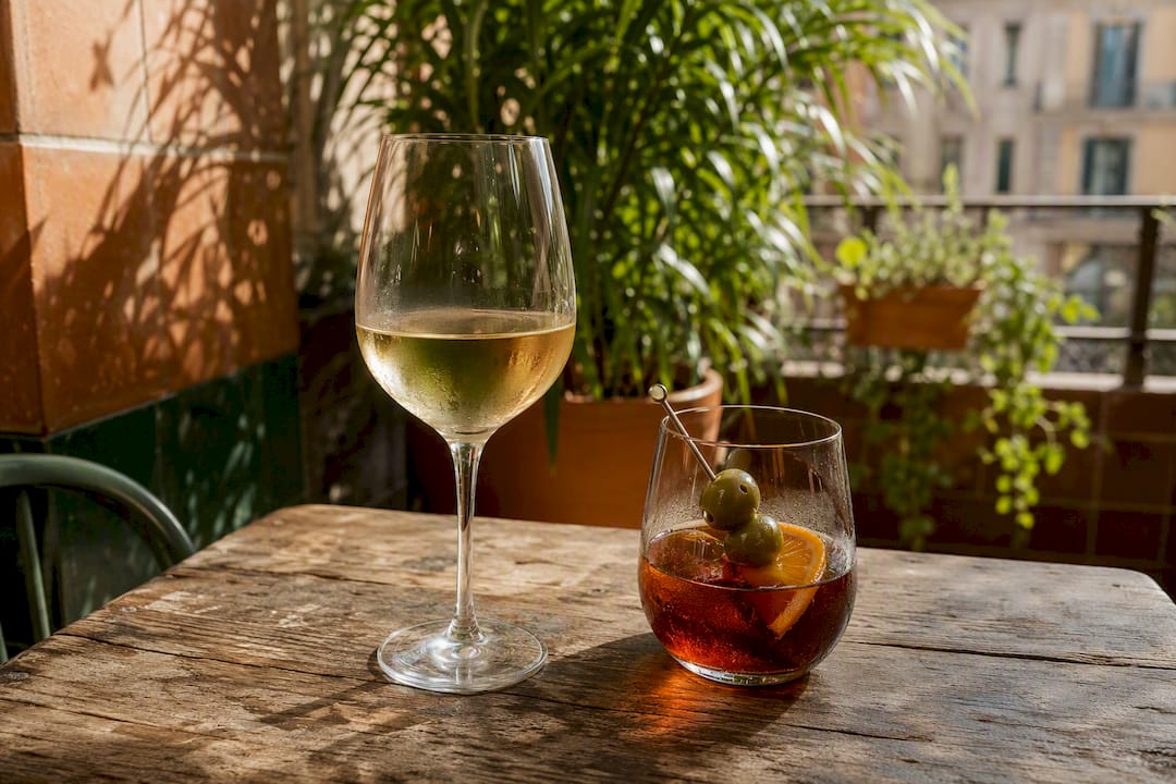 White wine and vermouth on terrace table