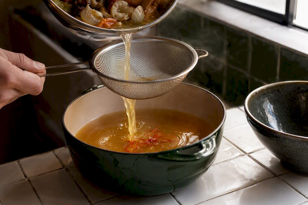 Saffron steeping in strained seafood fumet