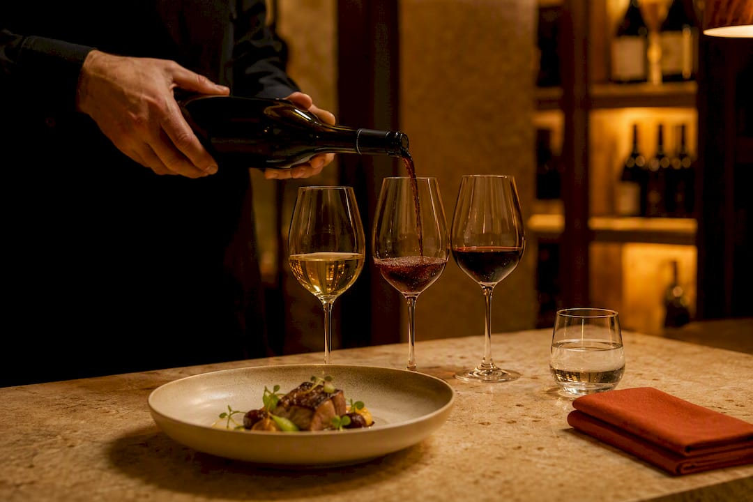 Sommelier pouring a partial wine pairing