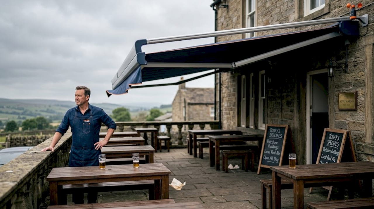 Pub manager monitoring wind sensor and awning