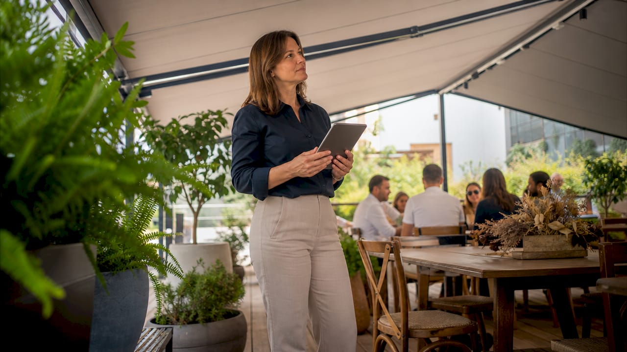Manager reviewing restaurant patio enclosure options