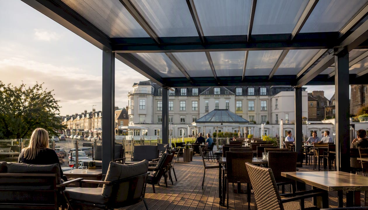 Large commercial pergola roof over hotel terrace
