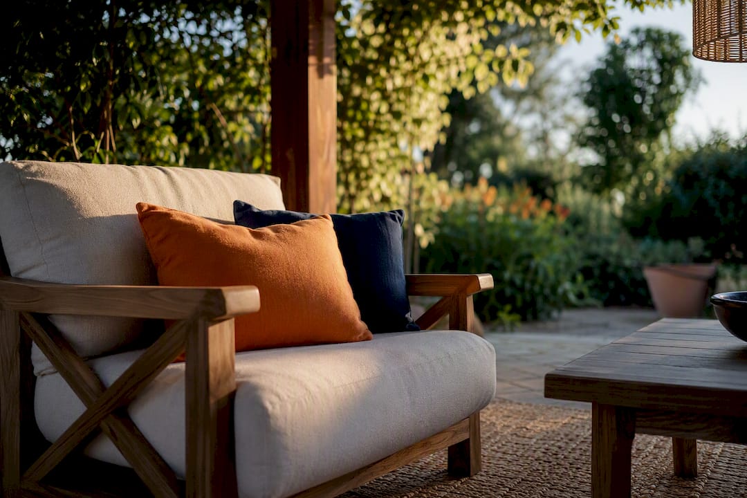 Pergola seating with cushions and rug