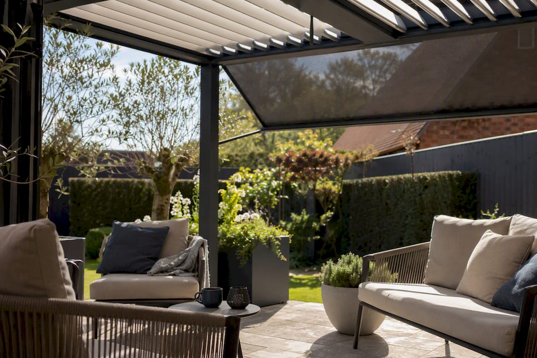 Shaded patio under pergola with furniture