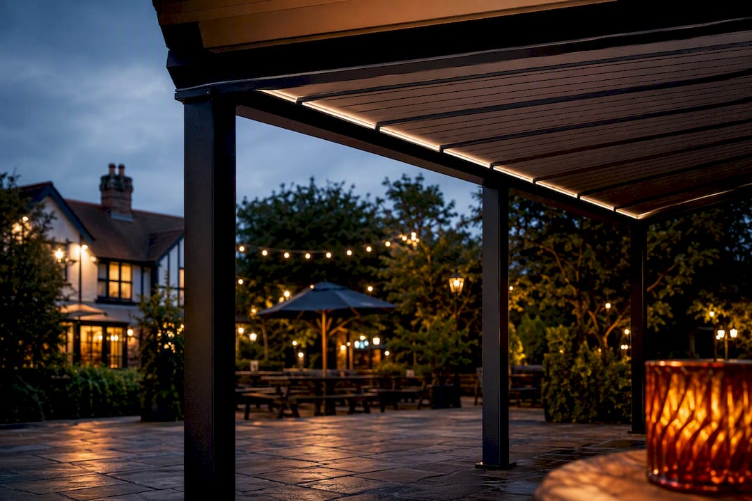 Open-sided smoking shelter beside UK pub