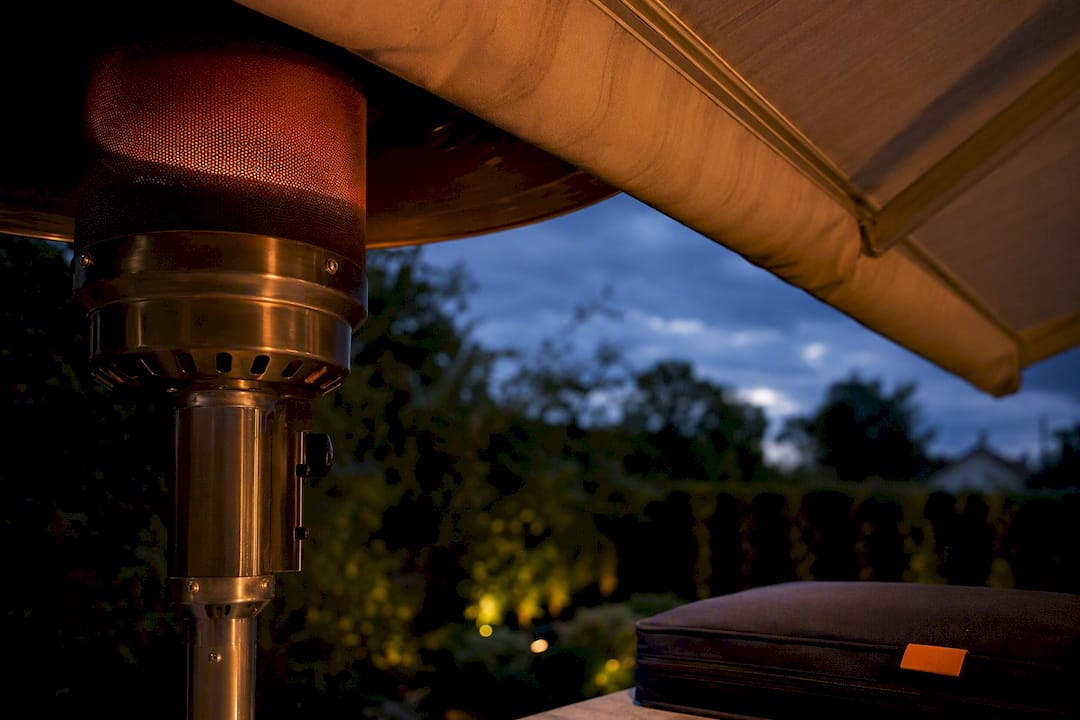 Patio heater beneath canopy with clearances