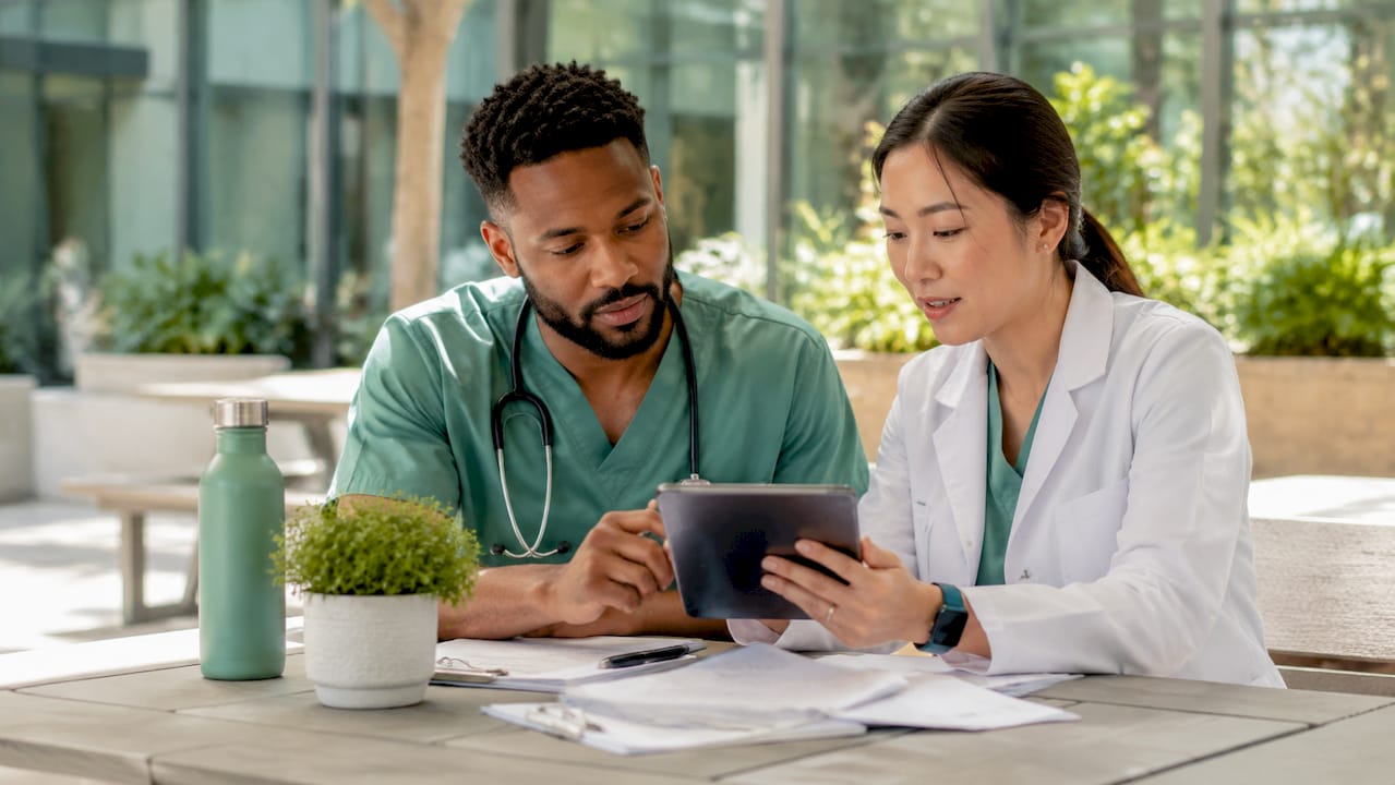 Healthcare staff discussing referral tracking methods