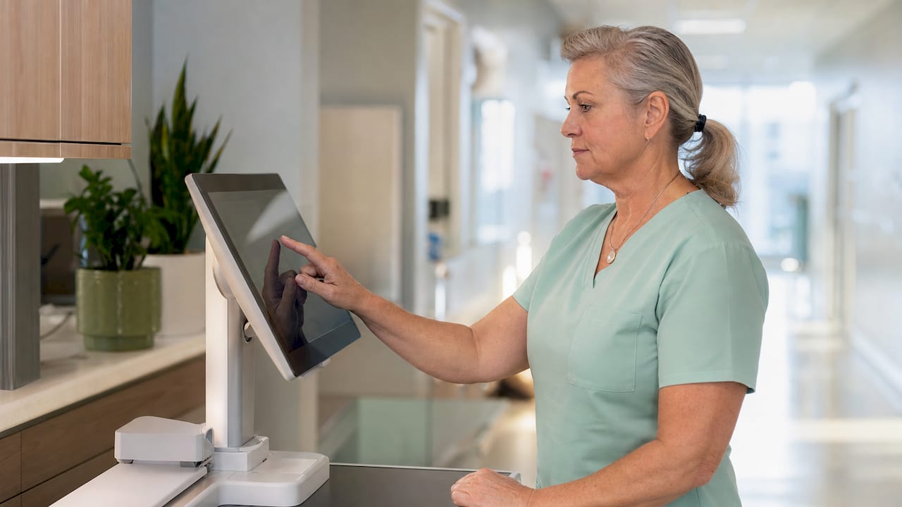Nurse configuring EMR patient safety alerts