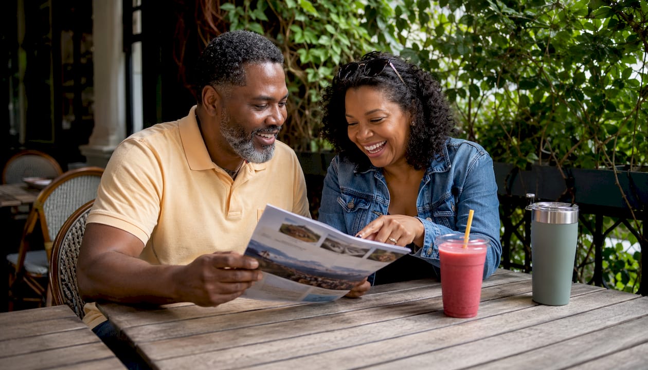 Couple checking restaurant reviews on tablet
