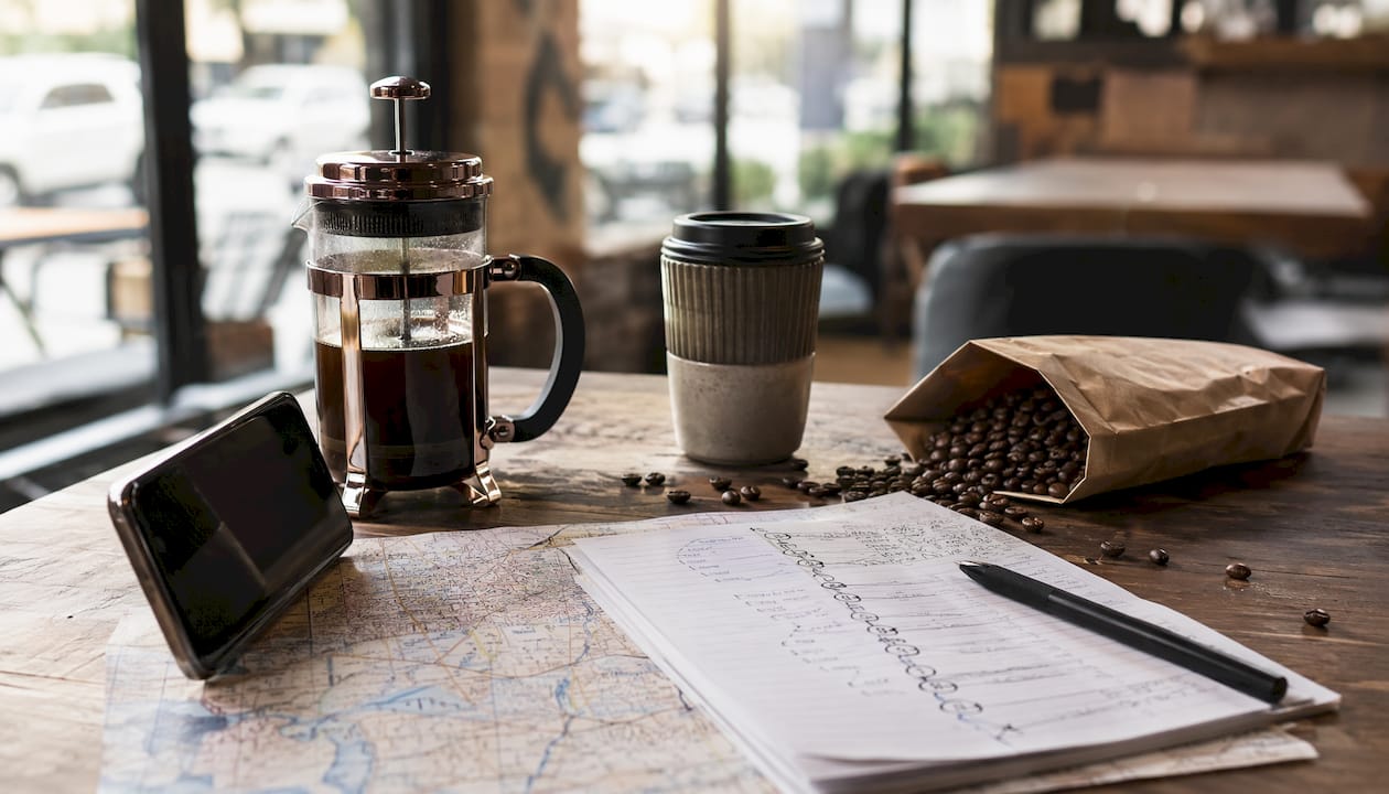 Coffee brewing gear with map and route notes