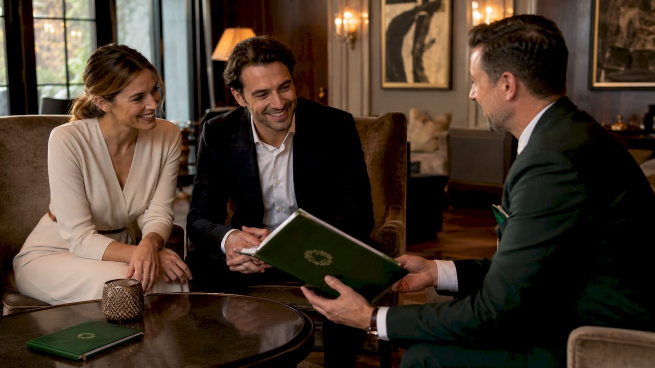 Concierge assisting guest in luxury hotel lobby