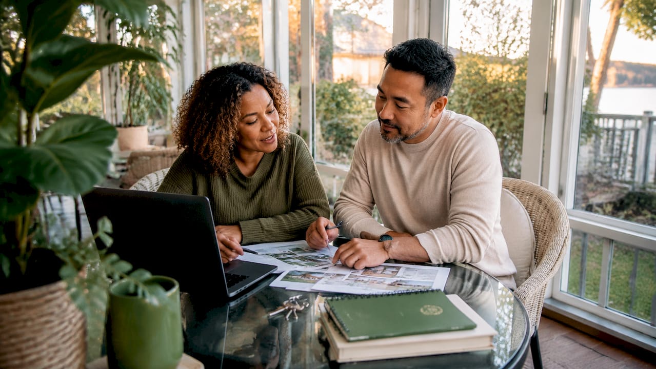 Couple reviewing vacation rental feedback