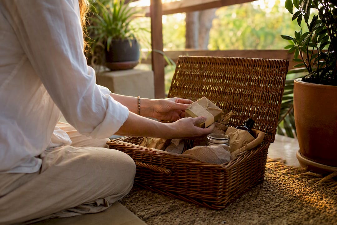 Guest unpacking local artisan hamper in rental entryway