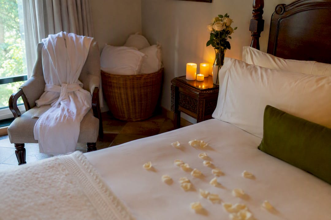 Luxury rental bedroom with linens and candles