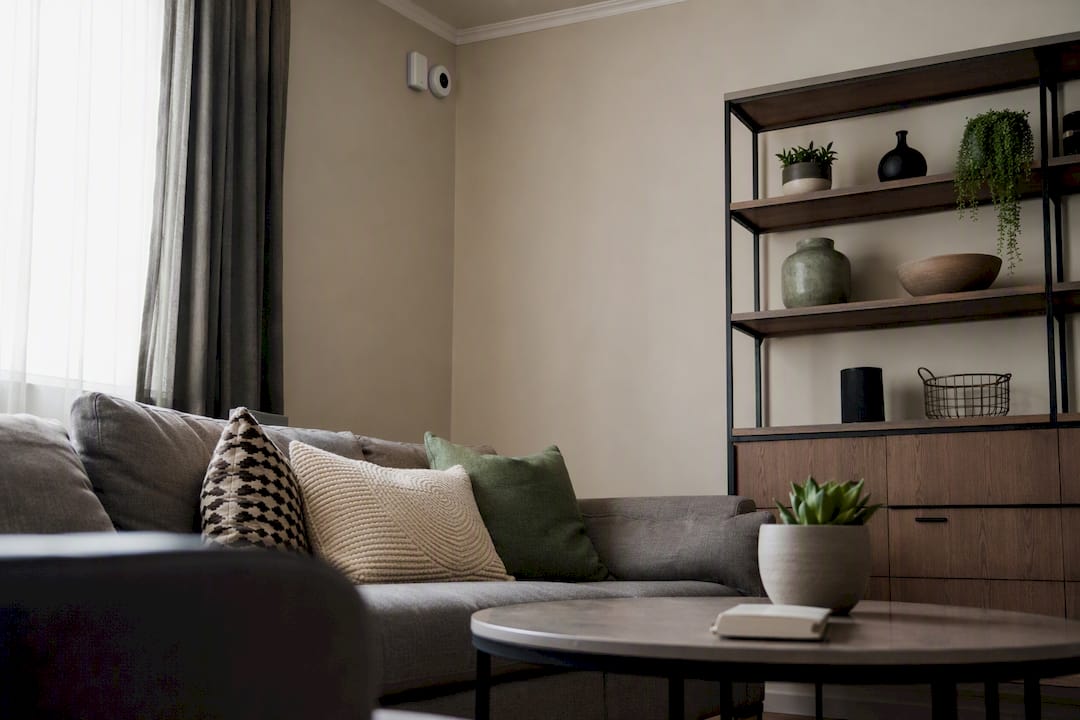 Noise monitoring devices mounted on rental living room wall