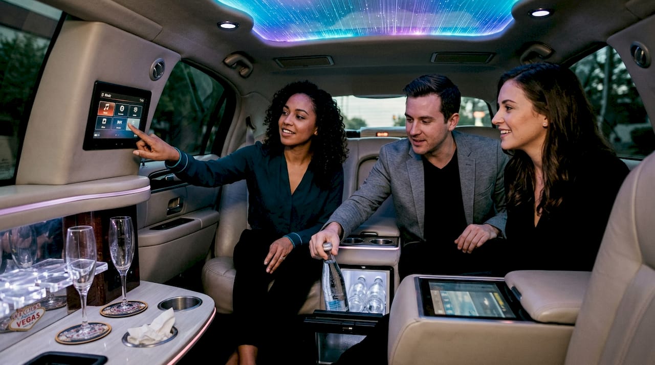 Guests enjoying VIP limo interior features