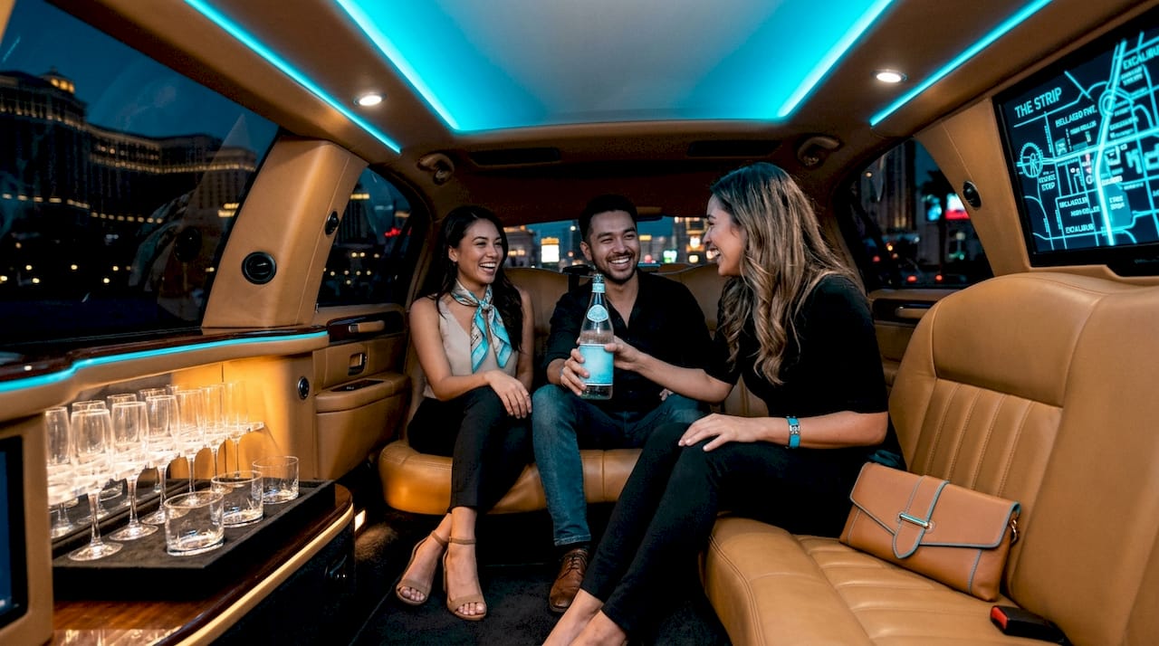 Friends enjoying limo amenities in Las Vegas
