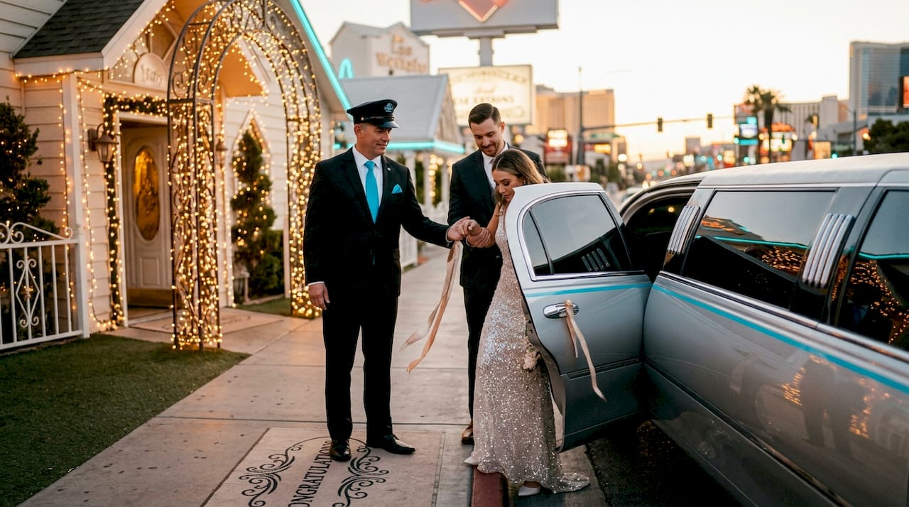 Bride exits limousine at Vegas chapel with chauffeur