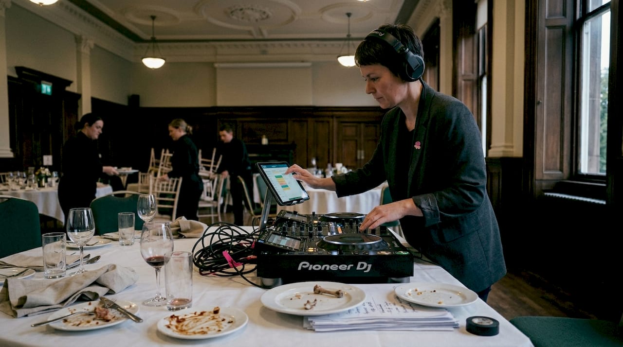 DJ managing transitions at corporate banquet