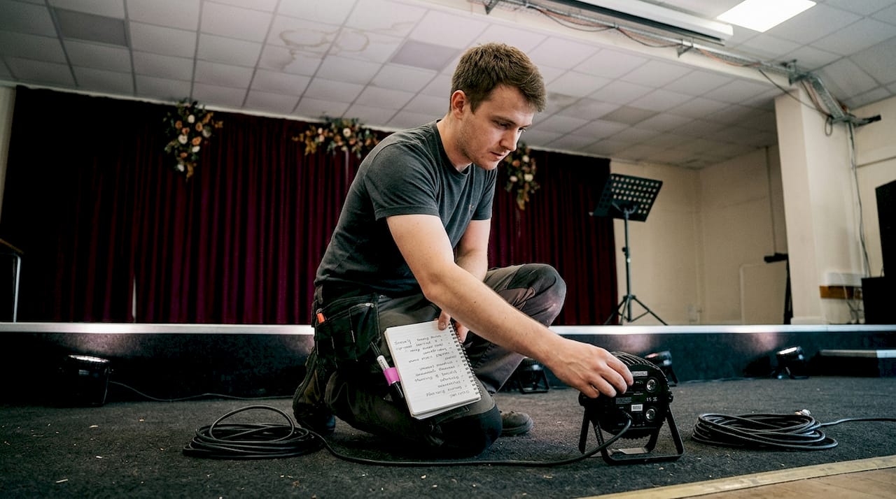 Lighting technician setting up wedding effects
