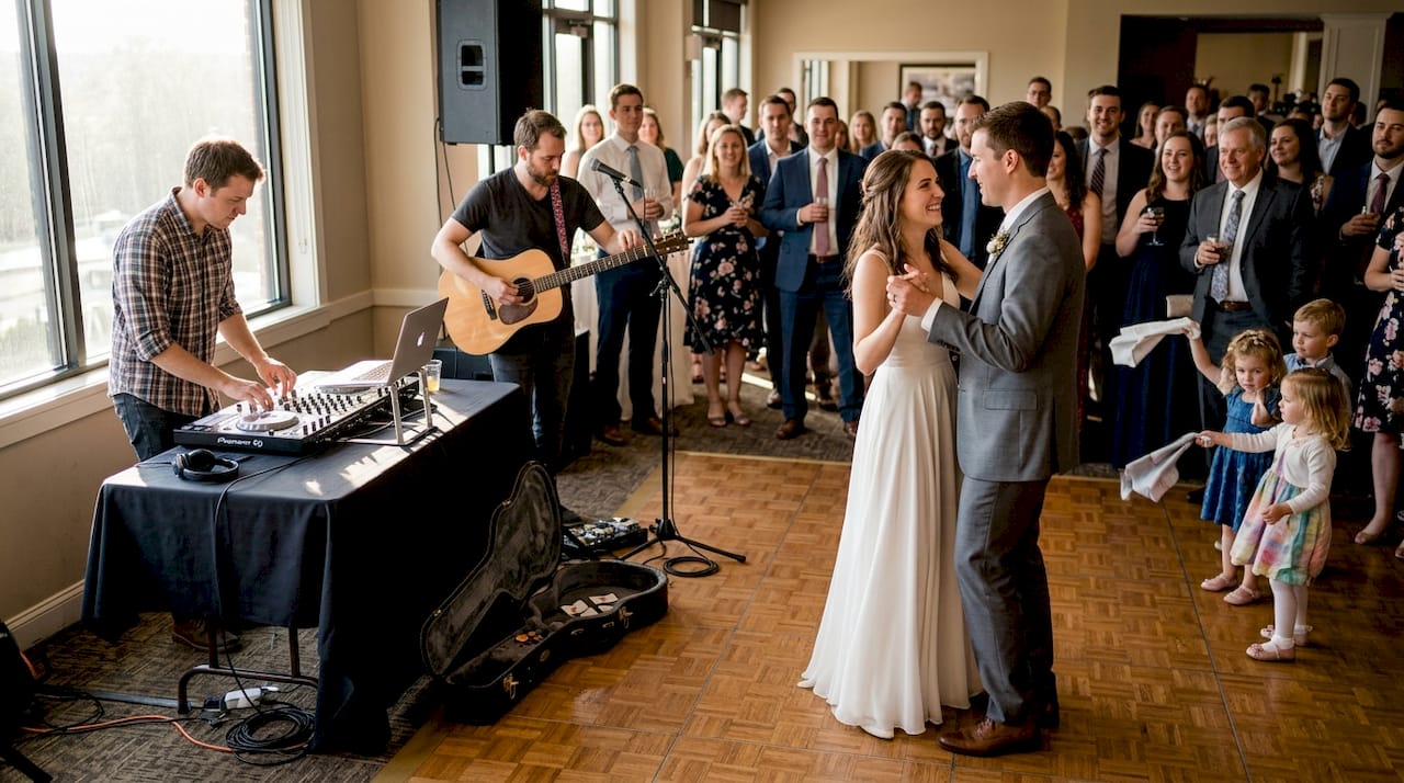 Couple dancing with DJ and guitarist preparing
