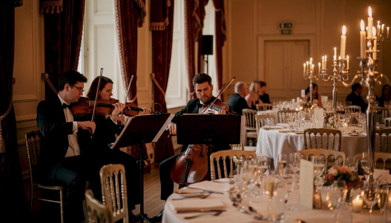 String quartet plays in wedding ballroom