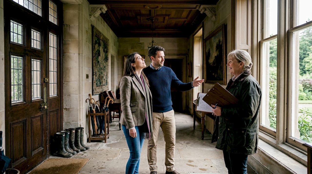 Couple touring Scottish manor wedding venue