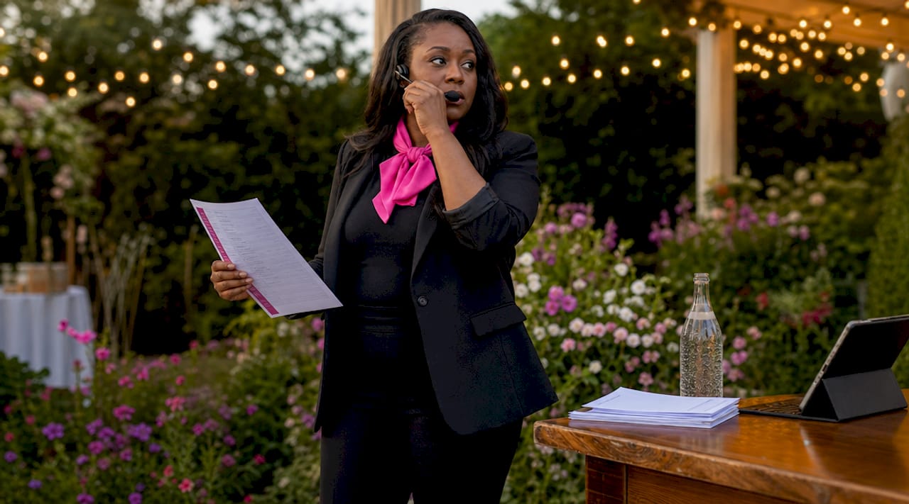 Wedding coordinator managing event timeline on wedding day