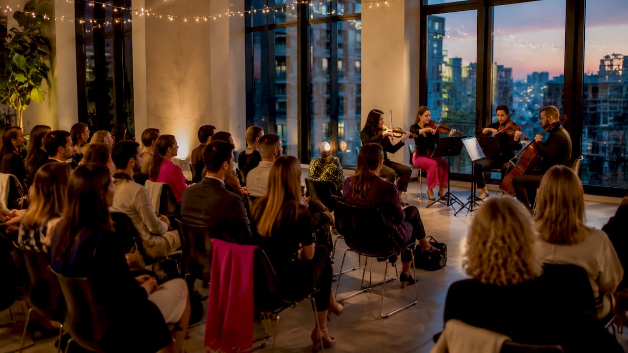 String quartet performing for intimate audience