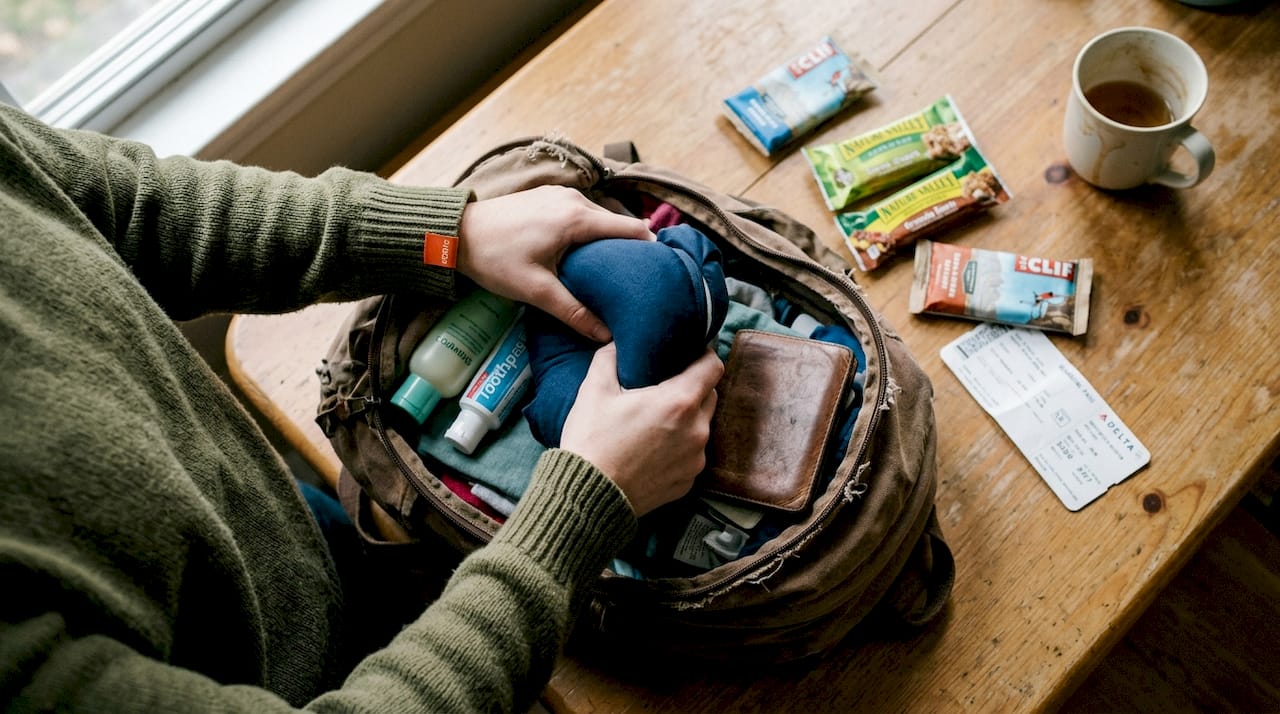 Packing memory foam pillow into travel backpack