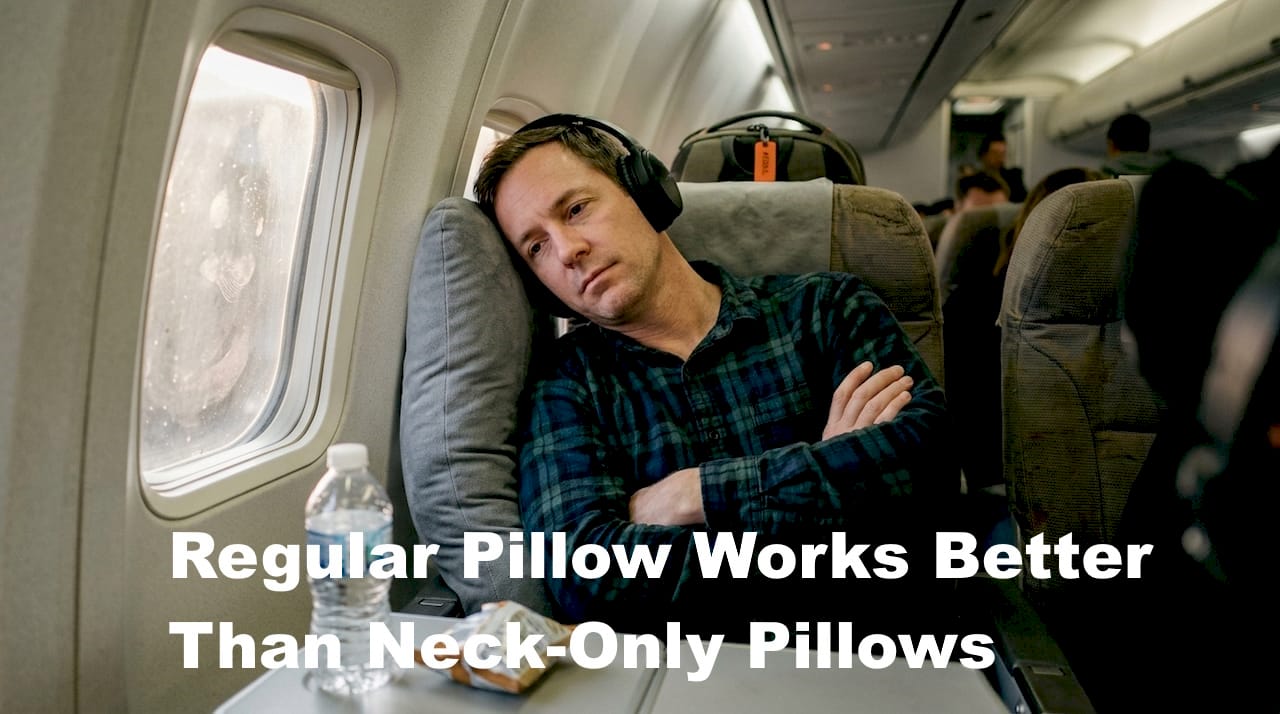 Passenger using body support pillow on airplane