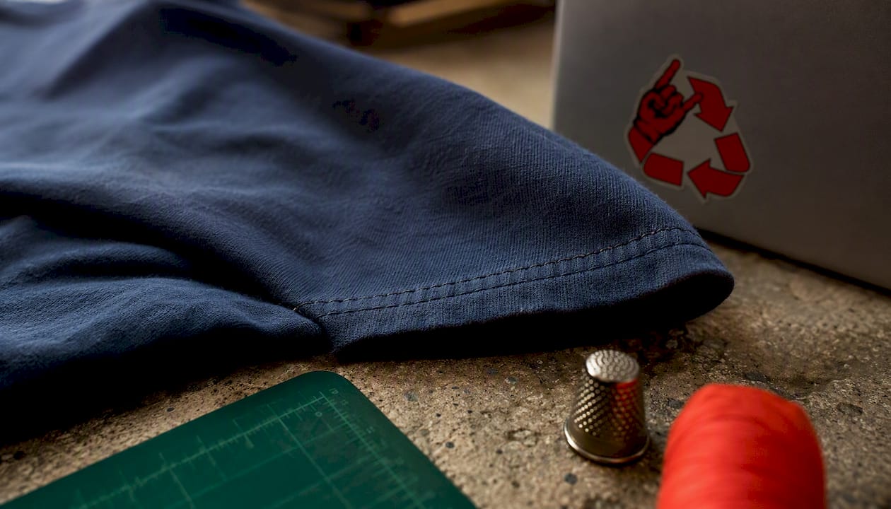 Close-up of single stitch on t-shirt sleeve hem