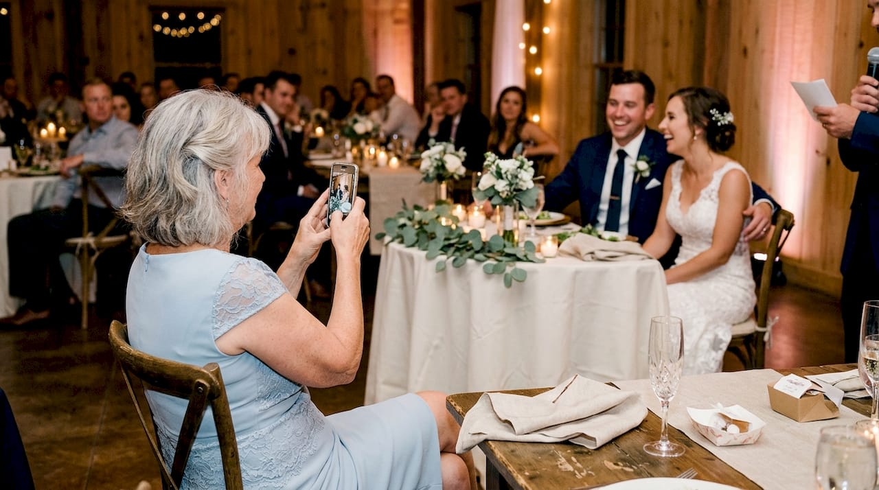 how qr wedding photo sharing captures every candid moment 17 Guest capturing candid couple photo at wedding