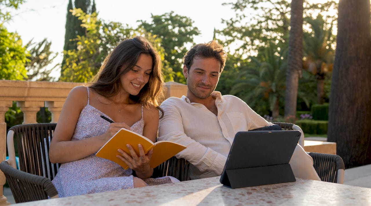 the role of editing in wedding videos explained 1 Couple reviewing wedding video pacing on laptop