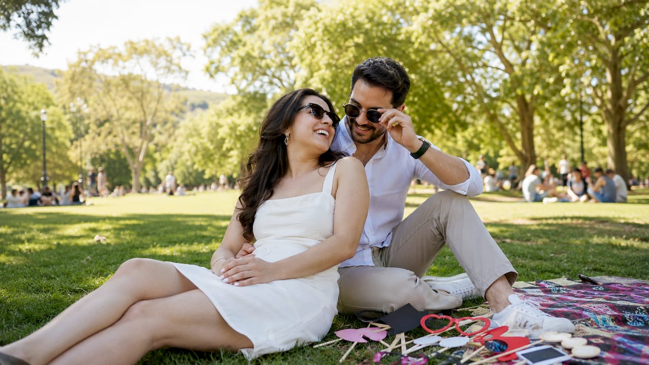 why capture engagement moments: a couple's guide 1 Close-up candid moment on rooftop bench