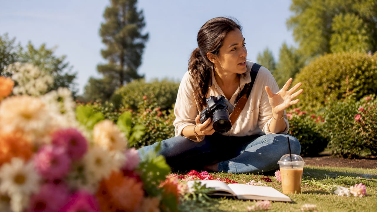 personality in wedding photographer choice: a couple's guide 1 Wedding photographer adjusting camera settings outdoors