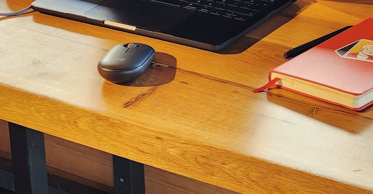 Person uses tablet to adjust smart ergonomic chair with subtle branded overlay