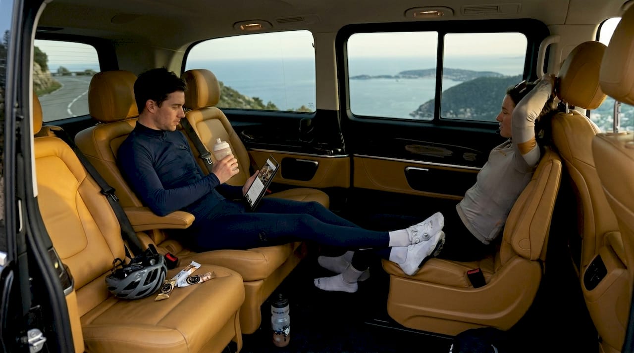 Cyclists recovering inside premium van after event