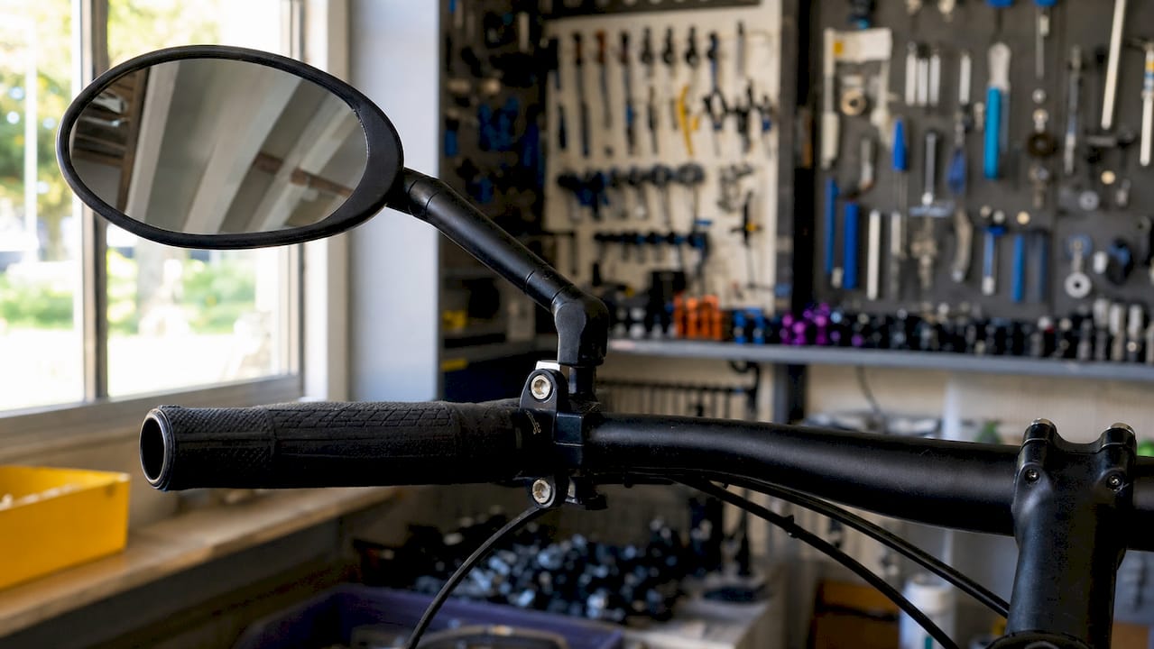 Close-up of handlebar clamp mirror on bike